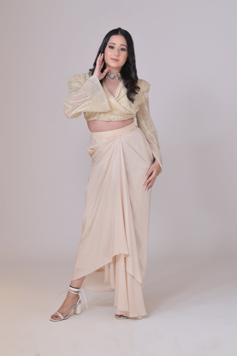 Ivory crop jacket with geometrical cutdana work and a crepe drape skirt