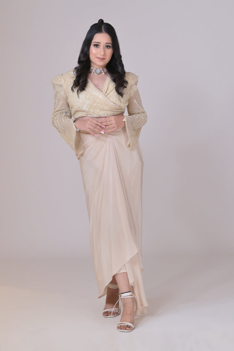 Ivory crop jacket with geometrical cutdana work and a crepe drape skirt