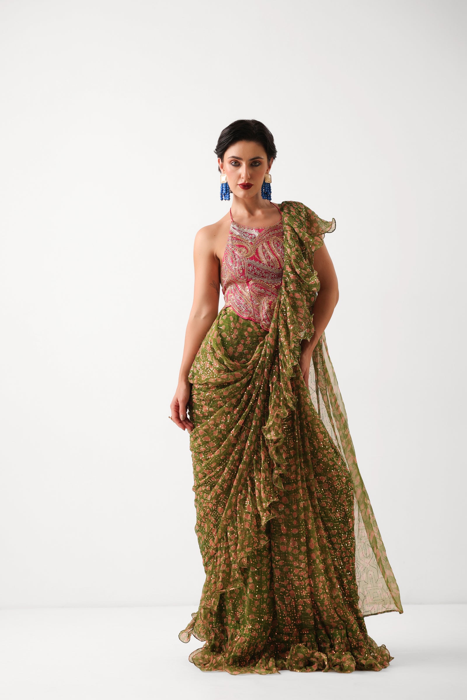 The Ezra Jhilmil saree set in avacado green with rani ambi blouse