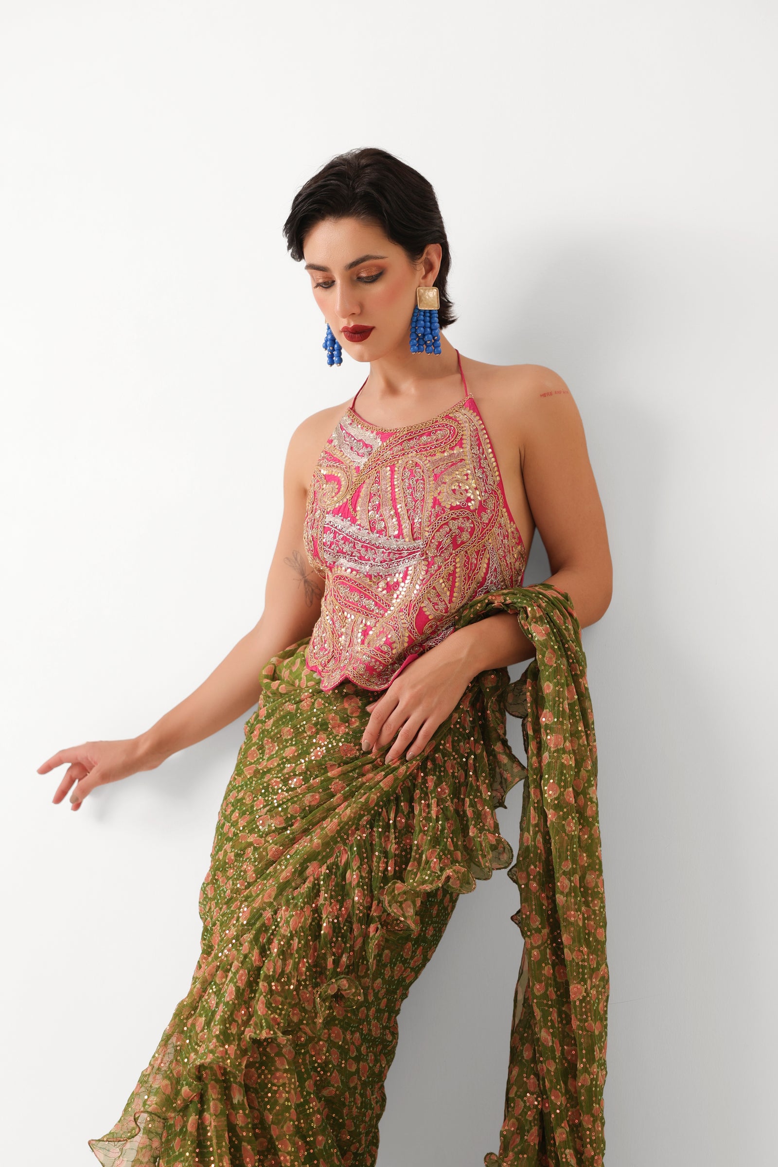 The Ezra Jhilmil saree set in avacado green with rani ambi blouse
