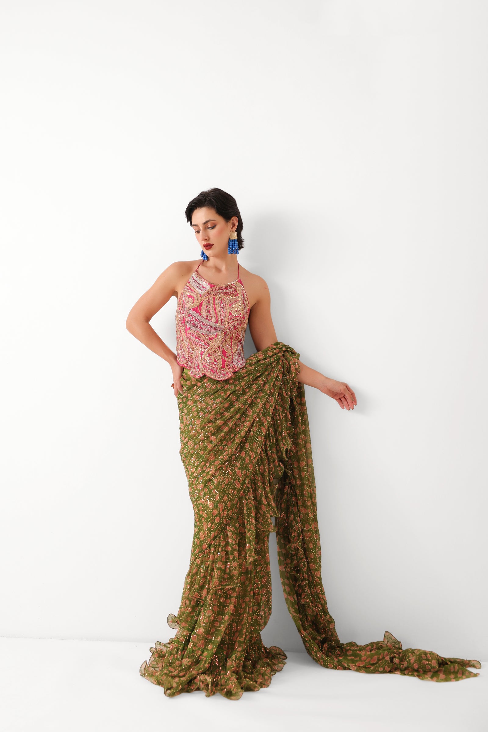 The Ezra Jhilmil saree set in avacado green with rani ambi blouse