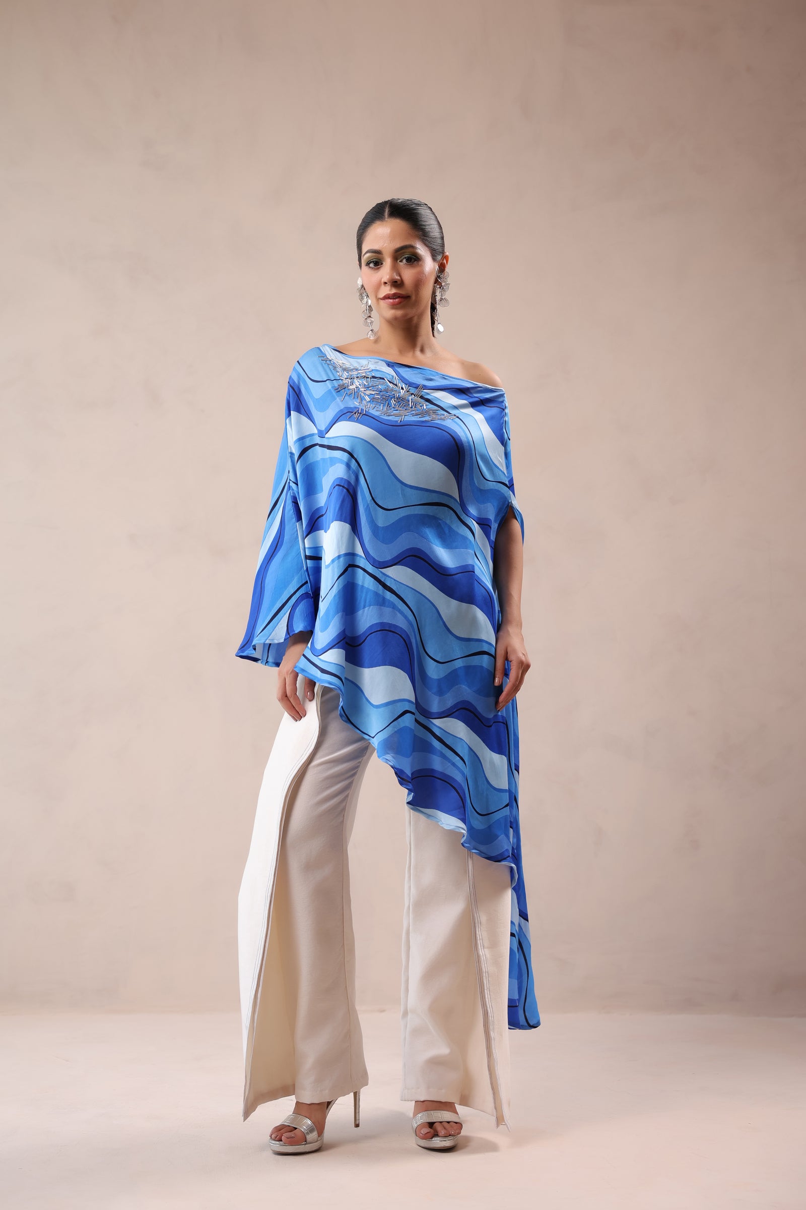 Atlantic Blue cruise cape with creme fall pants.