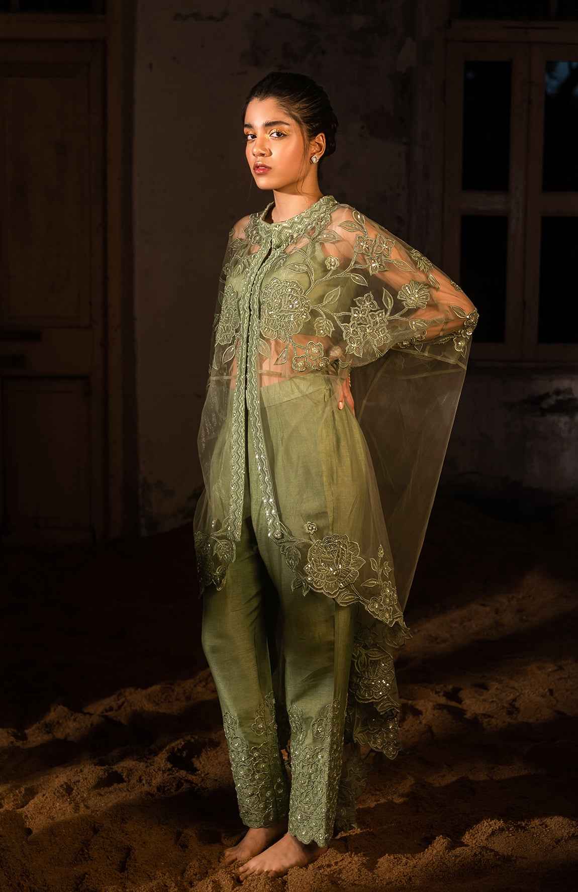 A Long Cape Paired With Bustier And Pants