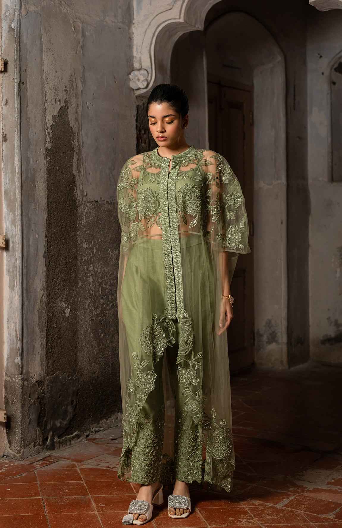 A Long Cape Paired With Bustier And Pants