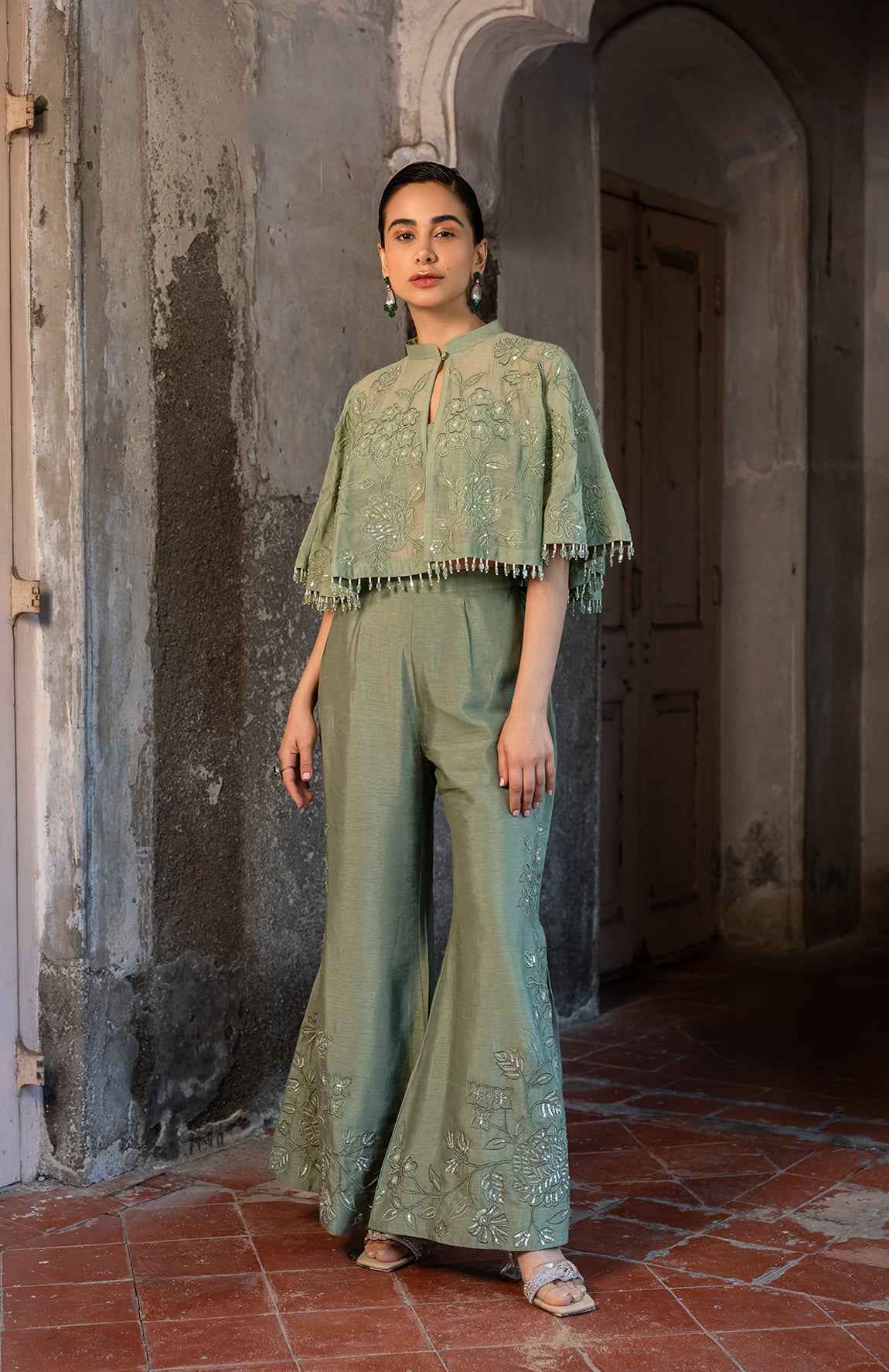 A Pista Green Cape With Side Cut Pant And Bustier