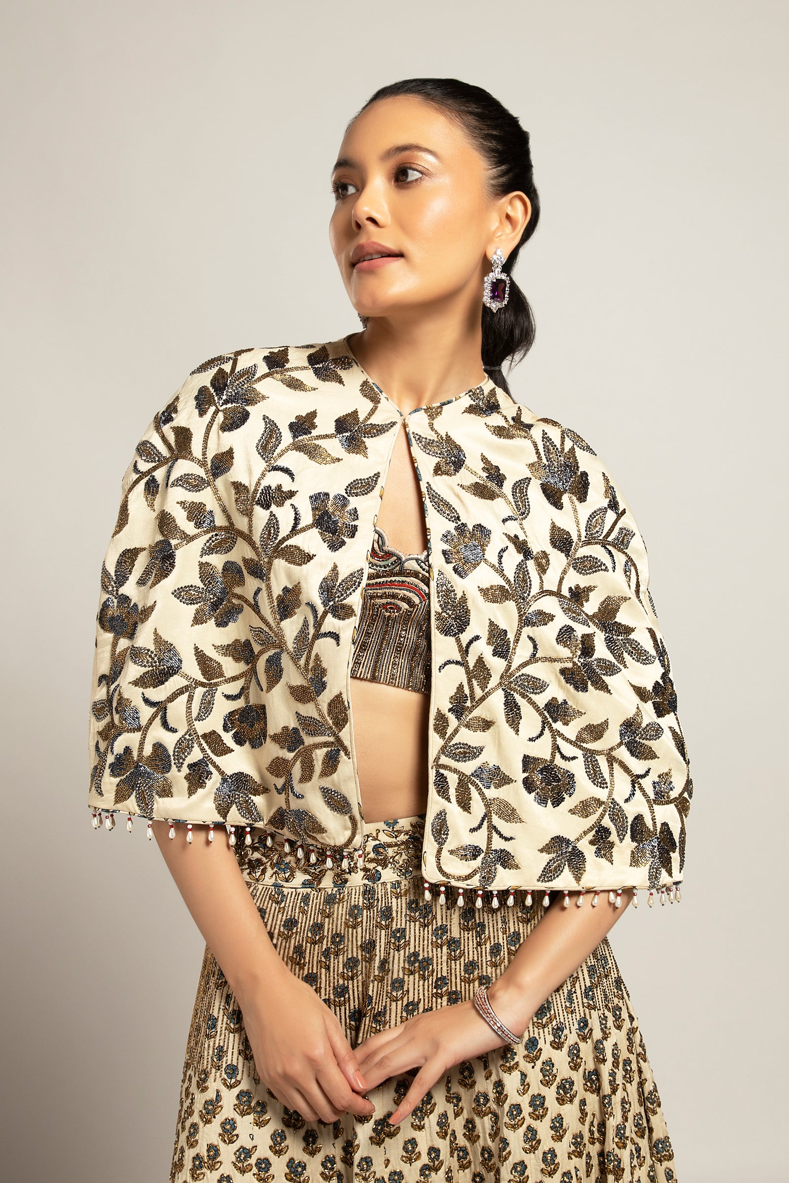 Lissome faded ivory blouse & Cape with Comely lehenga