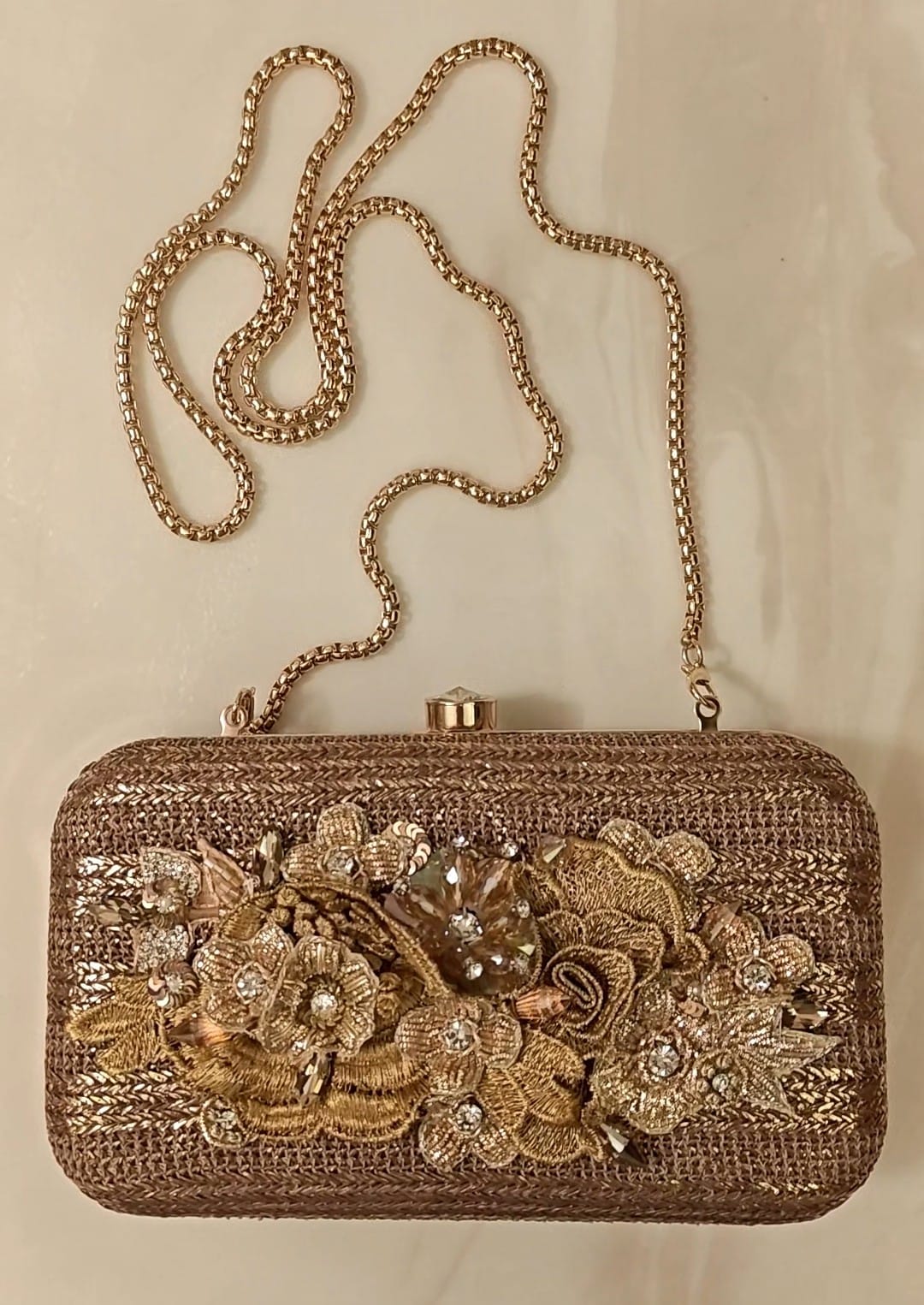 Bronze clutch/sling with a gold frame and a diamond clasp