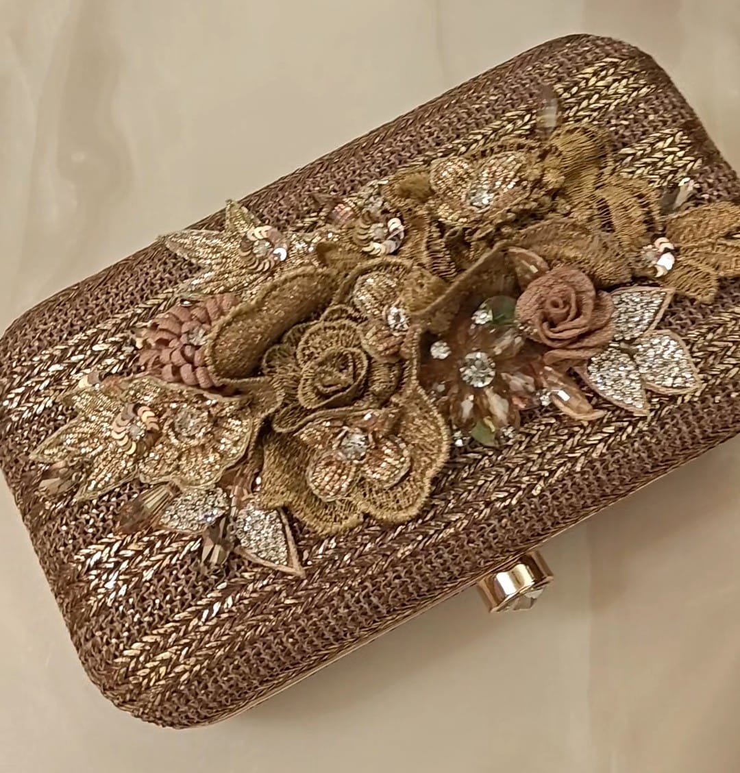 Bronze clutch/sling with a gold frame and a diamond clasp