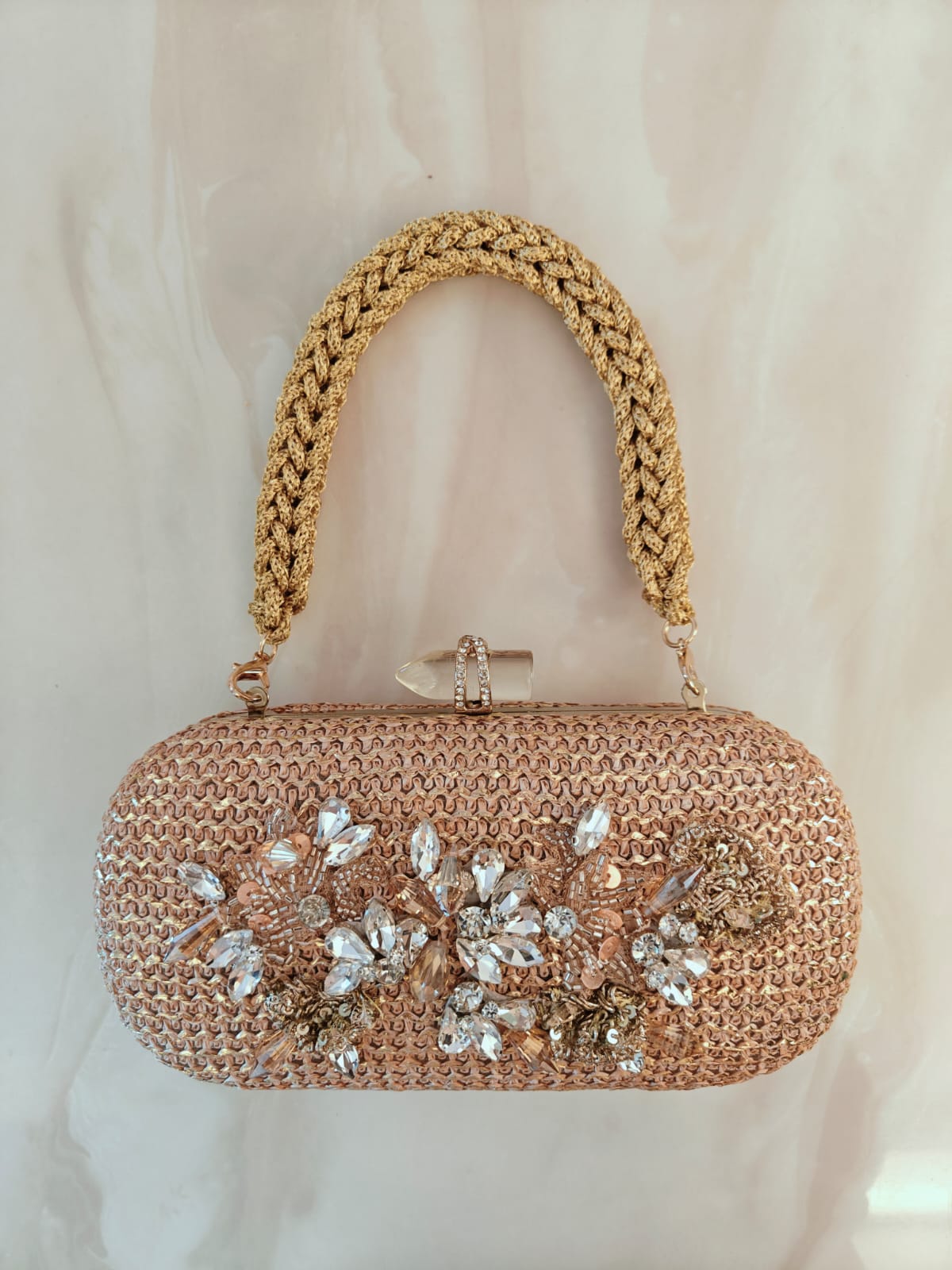 Floral diamond hand embroidered and set in a gold frame with a translucent clasp