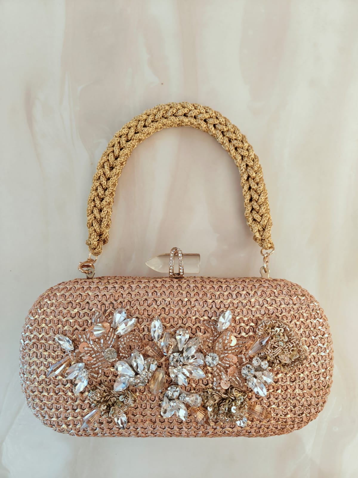 Floral diamond hand embroidered and set in a gold frame with a translucent clasp