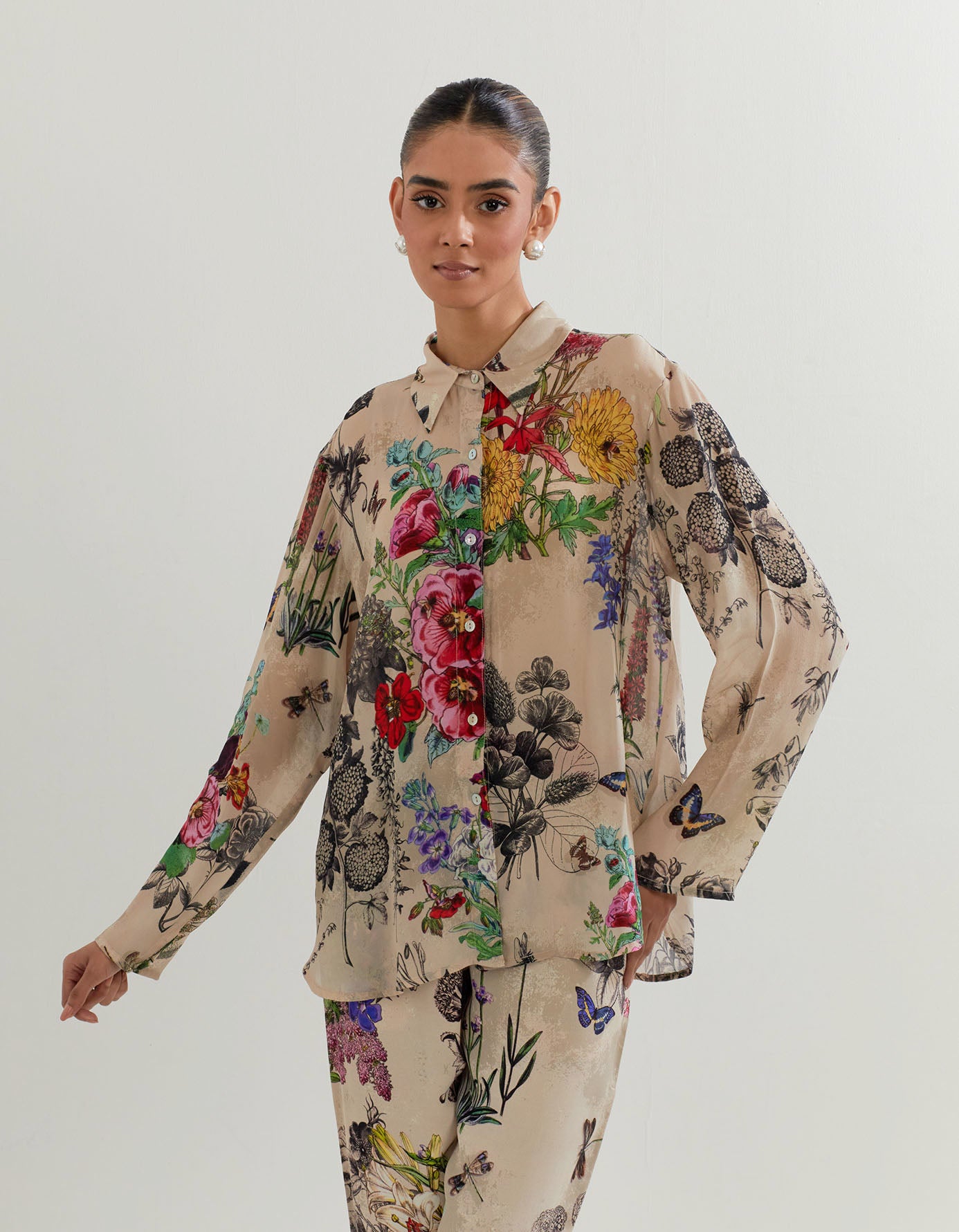 Crepe shirt in botanical print paired with heavy georgette pants