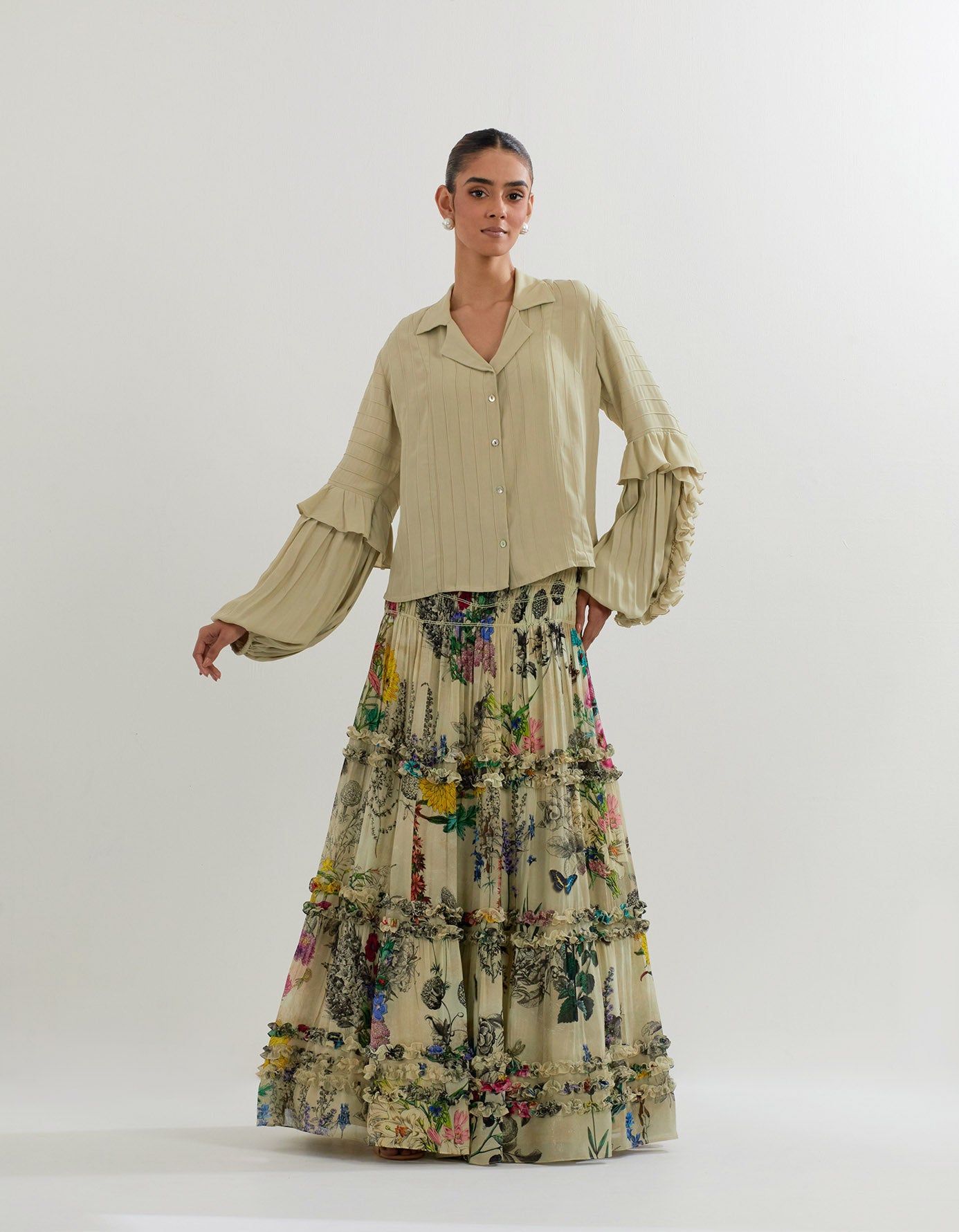 Botanical printed tiered skirt paired with heavy georgette pintucked ans ruffled shirt