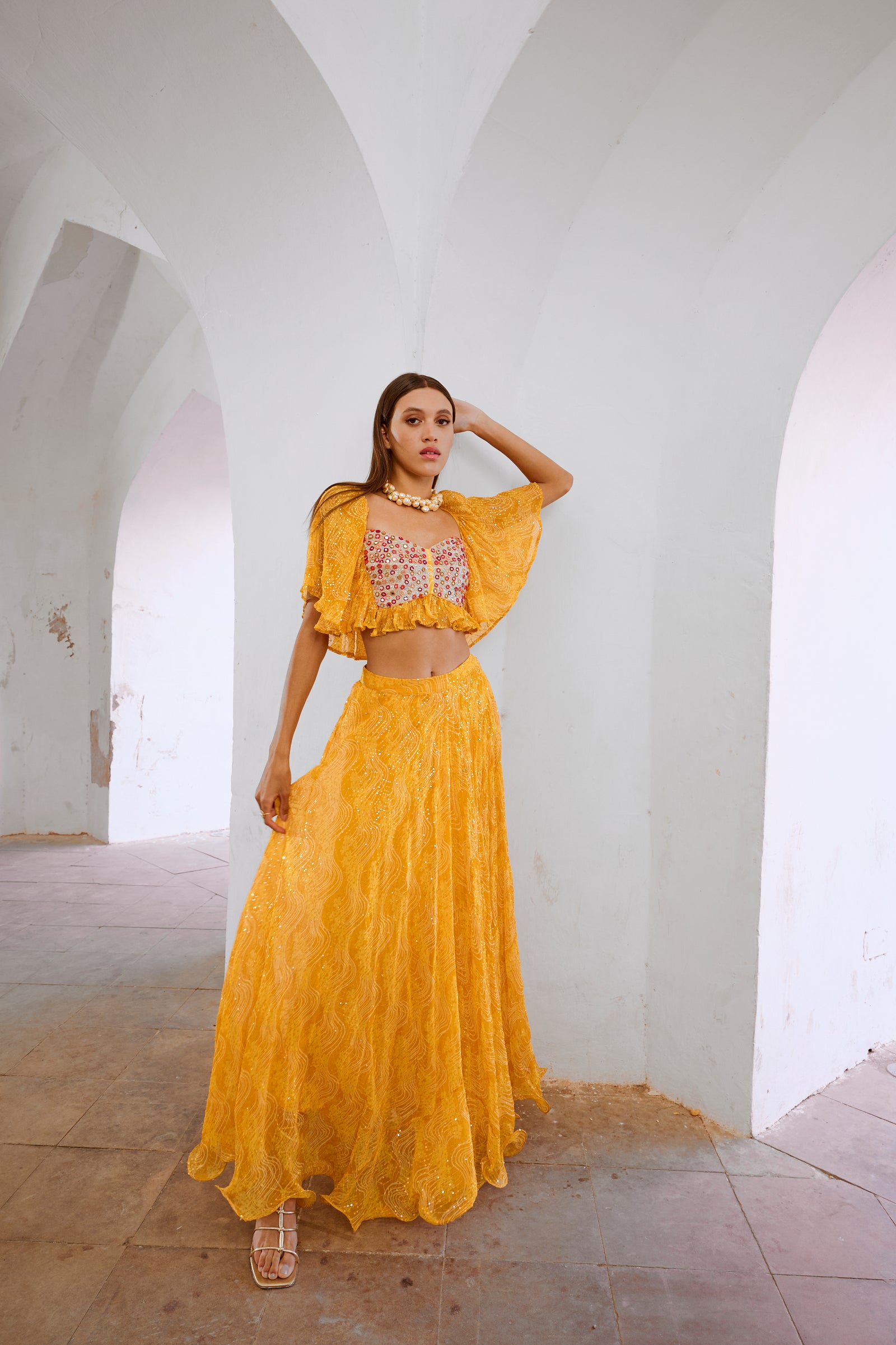 Gulbahar Marigold yellow  jugnu sitara butterfly blouse with flair skirt set.