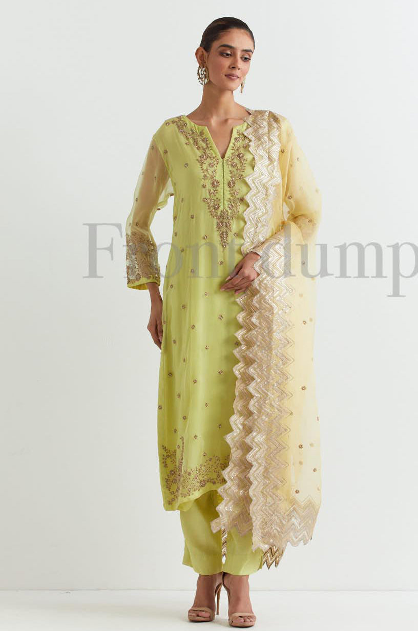Lime organza silk kurta in zardozi embroidery paired with chanderi silk pants and lemon chevron embroidered dupatta