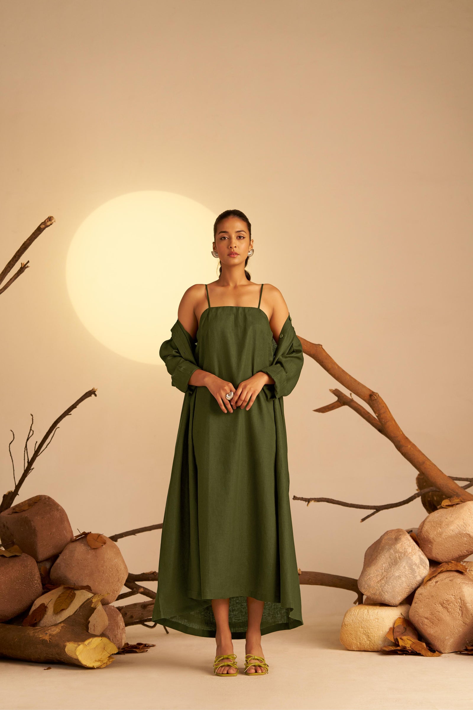 A Chic Two-In-One Ensemble Featuring A Sleek Olive Green Slip Dress