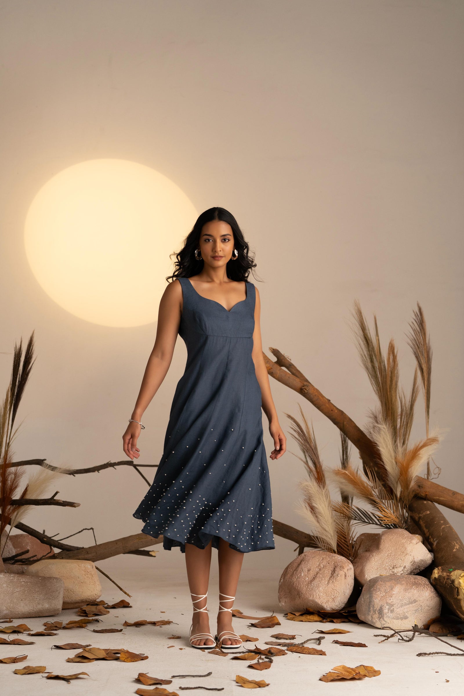 A Stunning Sleeveless Dress In Rich Midnight Blue, Featuring Delicate Pearl Embellishments Along The Hem For A Touch Of Elegance