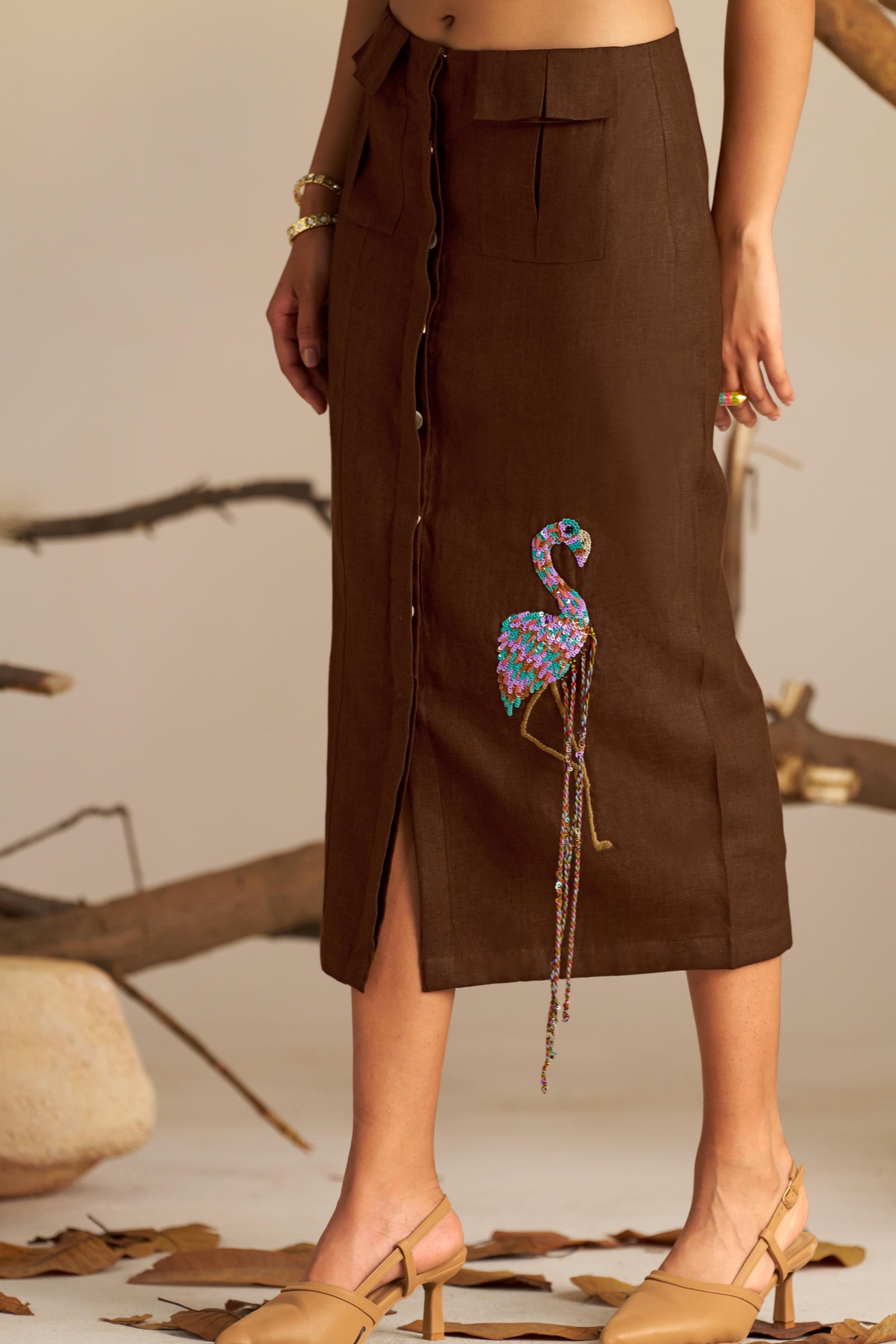 A Sleek Pencil Skirt, Featuring a Cute Flamingo Embellishment For a Fun, Whimsical Touch