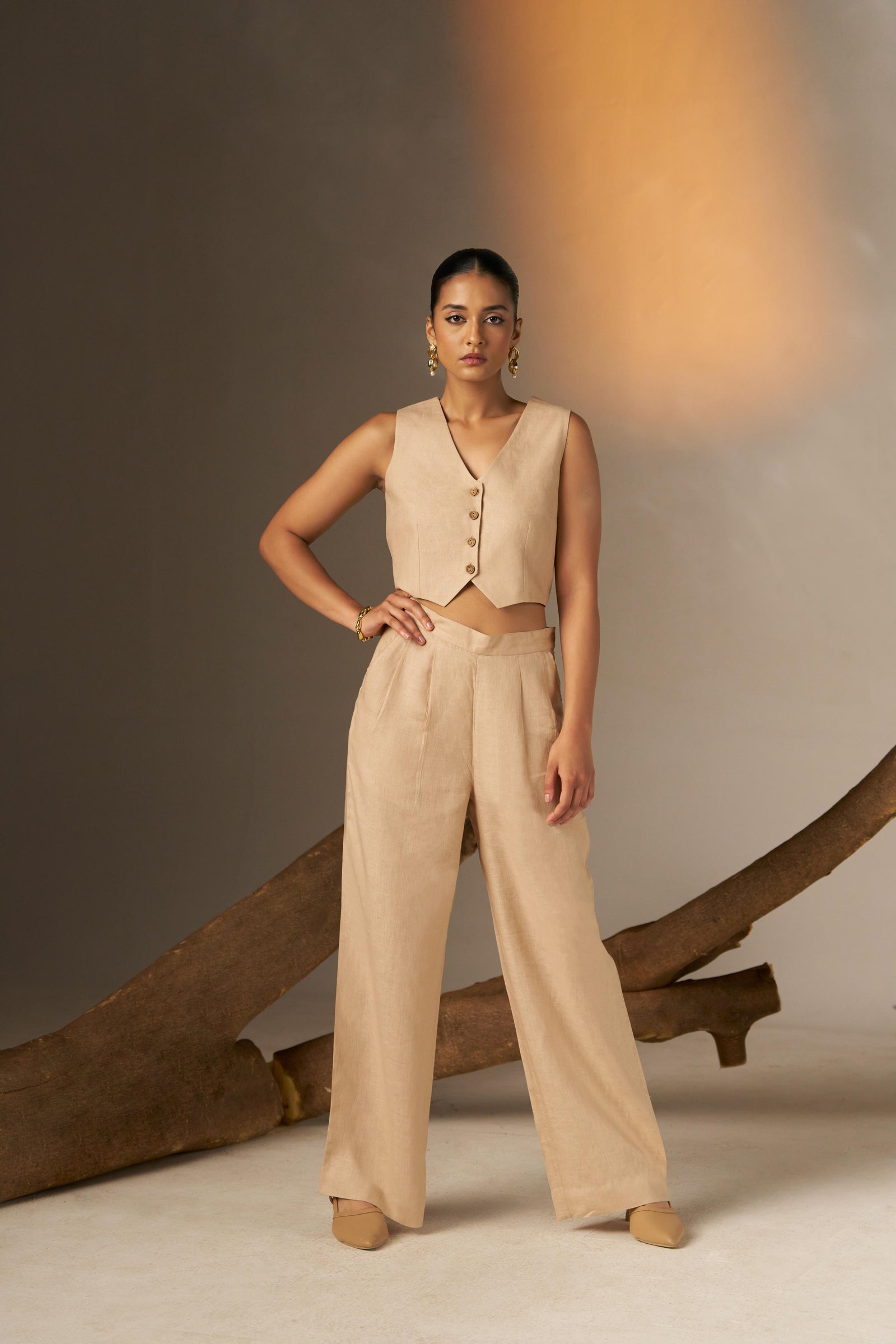 A Sleek And Sophisticated Soft Cosmic Latte Hue, Featuring A Tailored Vest