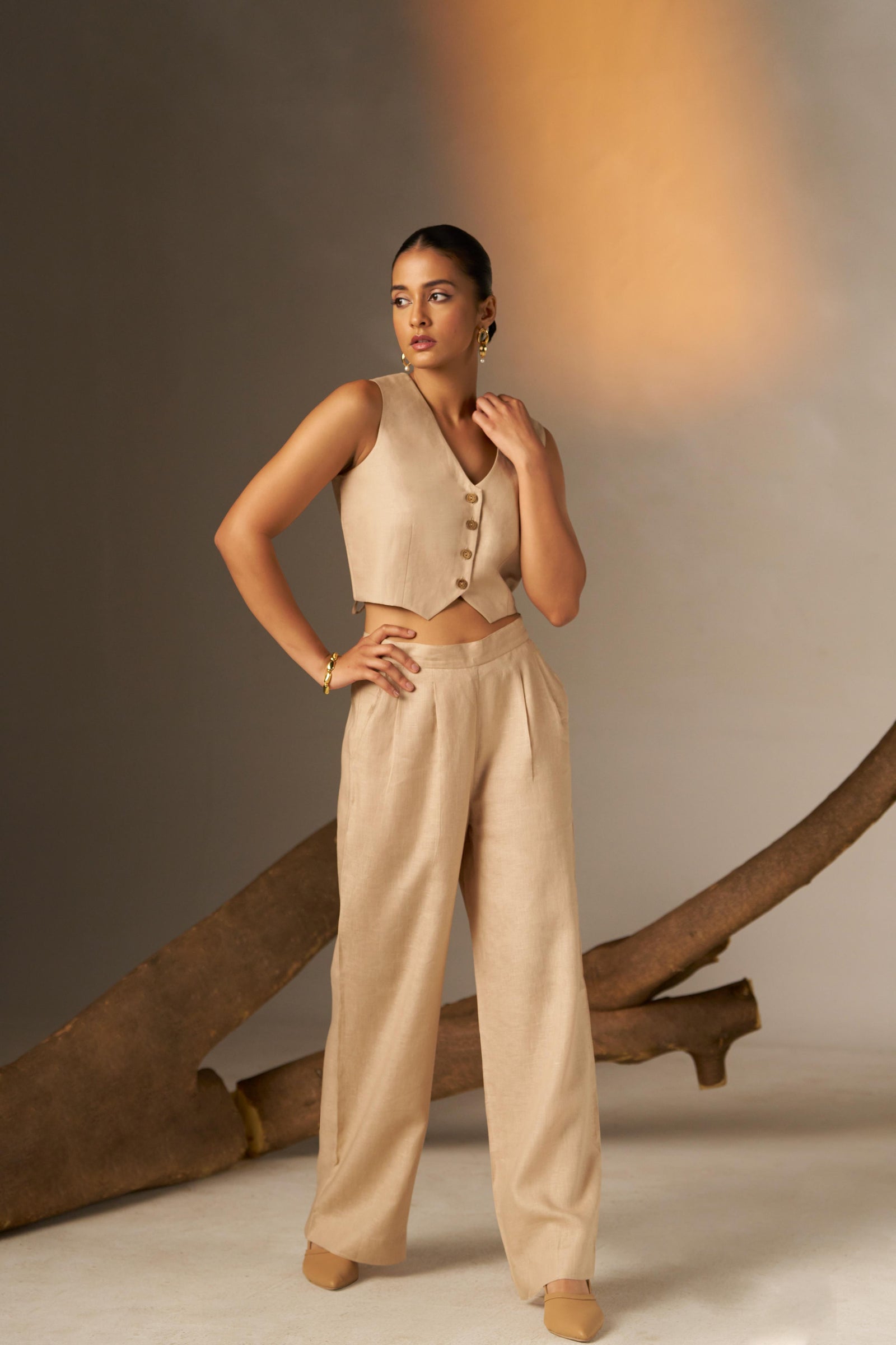 A Sleek And Sophisticated Soft Cosmic Latte Hue, Featuring A Tailored Vest