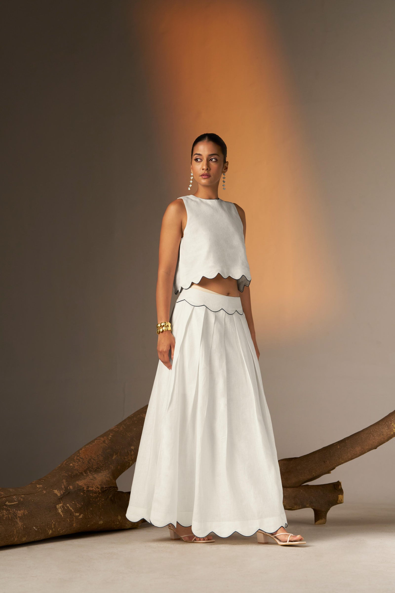 A Flared Skirt With Subtle Blue Finishing For A Crisp, Contemporary Touch