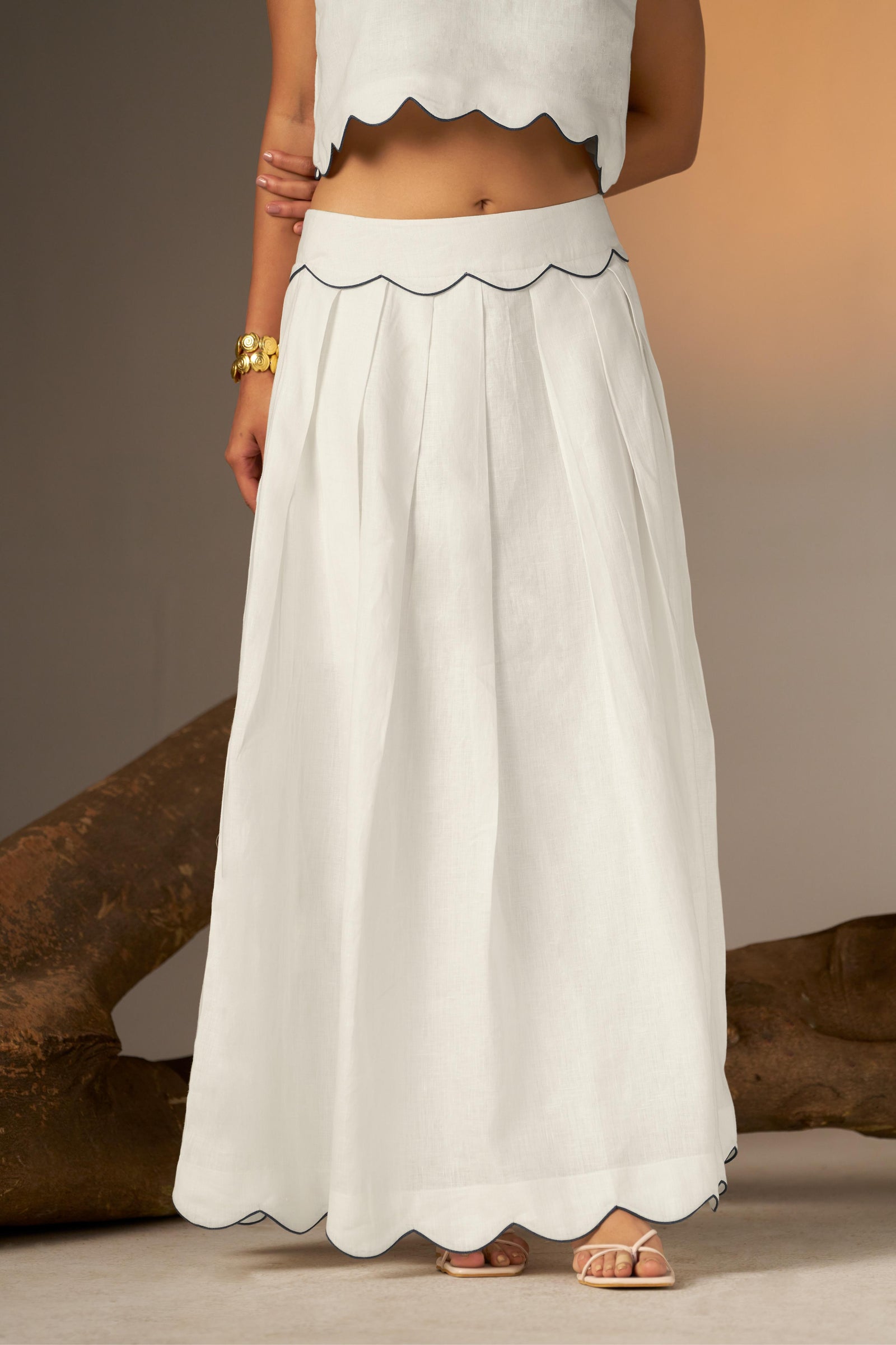 A Flared Skirt With Subtle Blue Finishing For A Crisp, Contemporary Touch