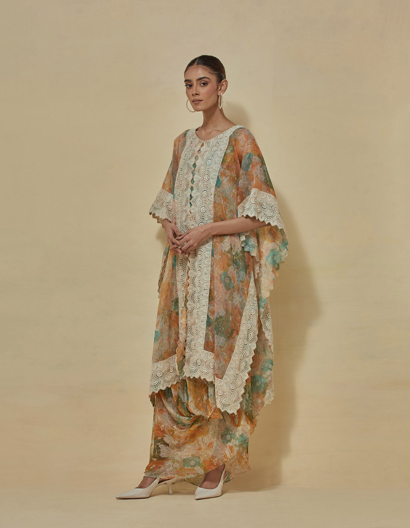 Chiffon printed dress paired with organza cape in thread embroidery border