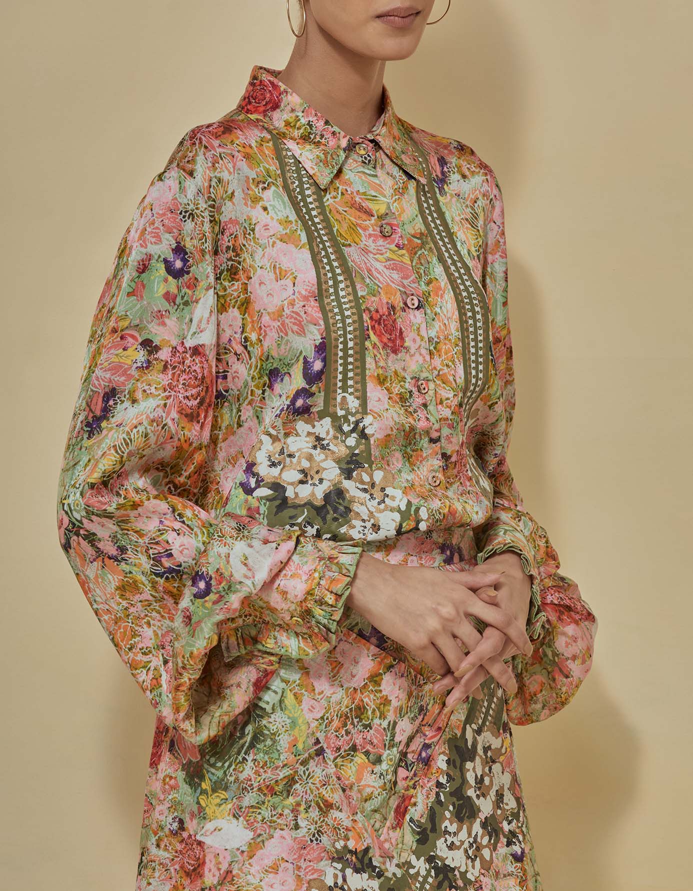 Printed satin shirt paired with draped printed skirt