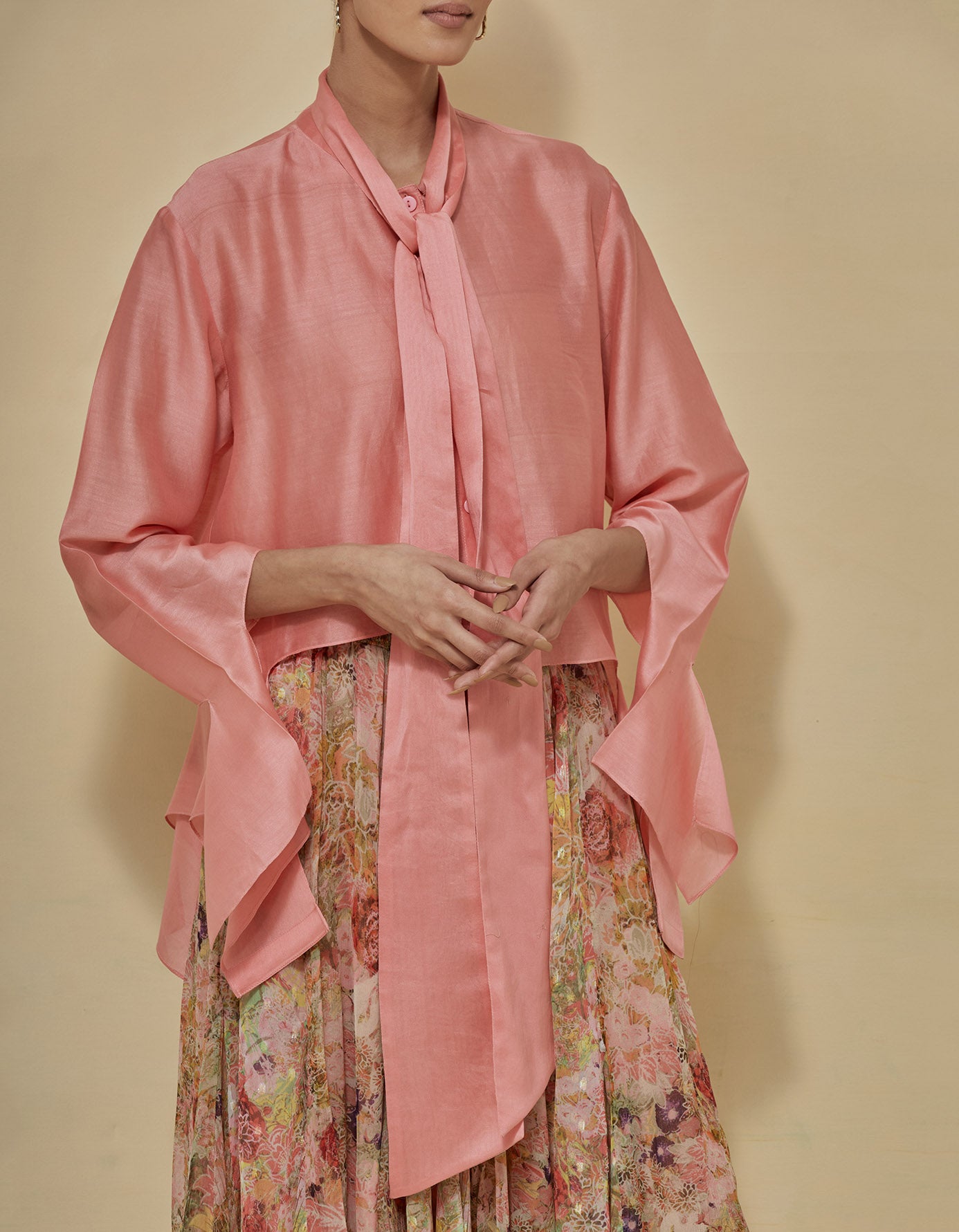 Peachish coral chanderi tie collar shirt paired with lurex chiffon printed godet skirt