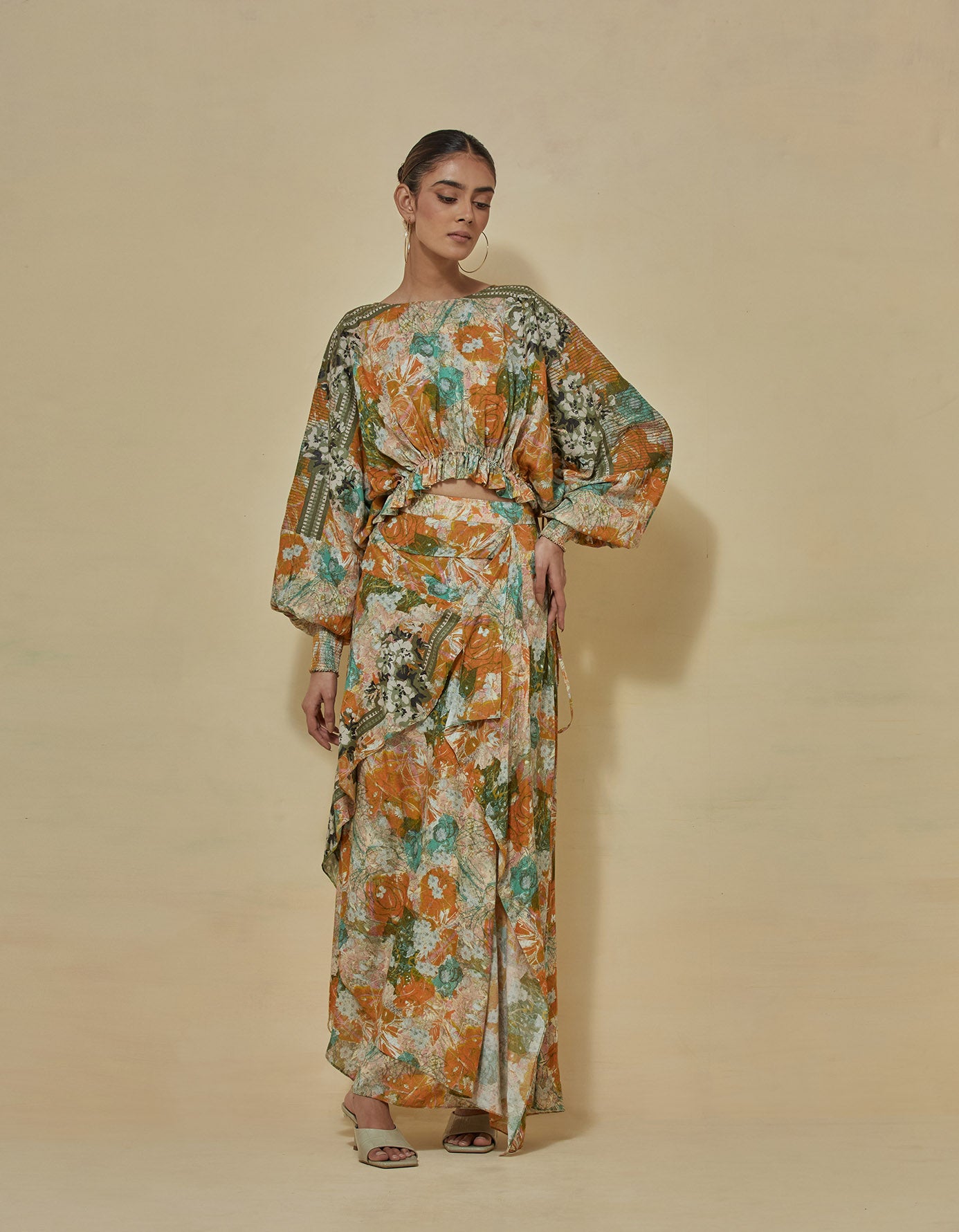 Printed crop top paired with draped printed skirt