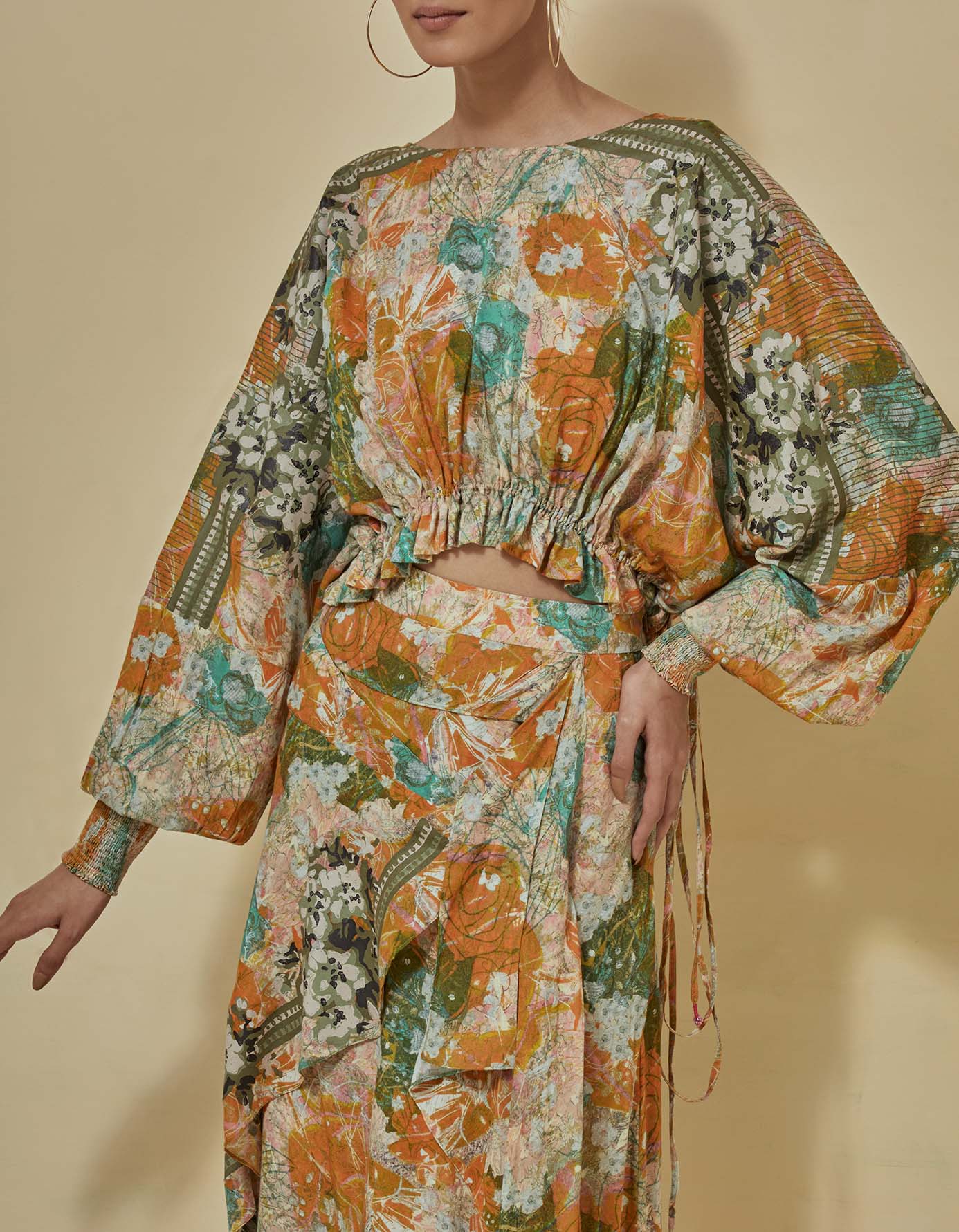 Printed crop top paired with draped printed skirt