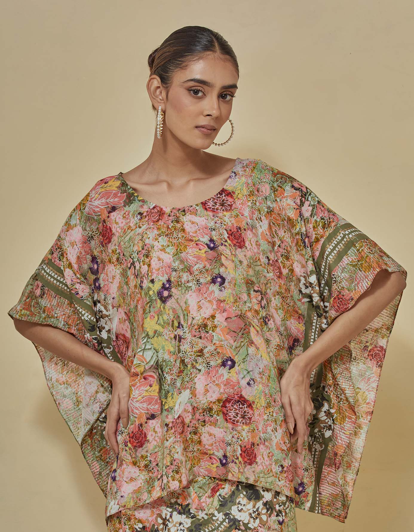 Printed kaftan top paired draped printed skirt