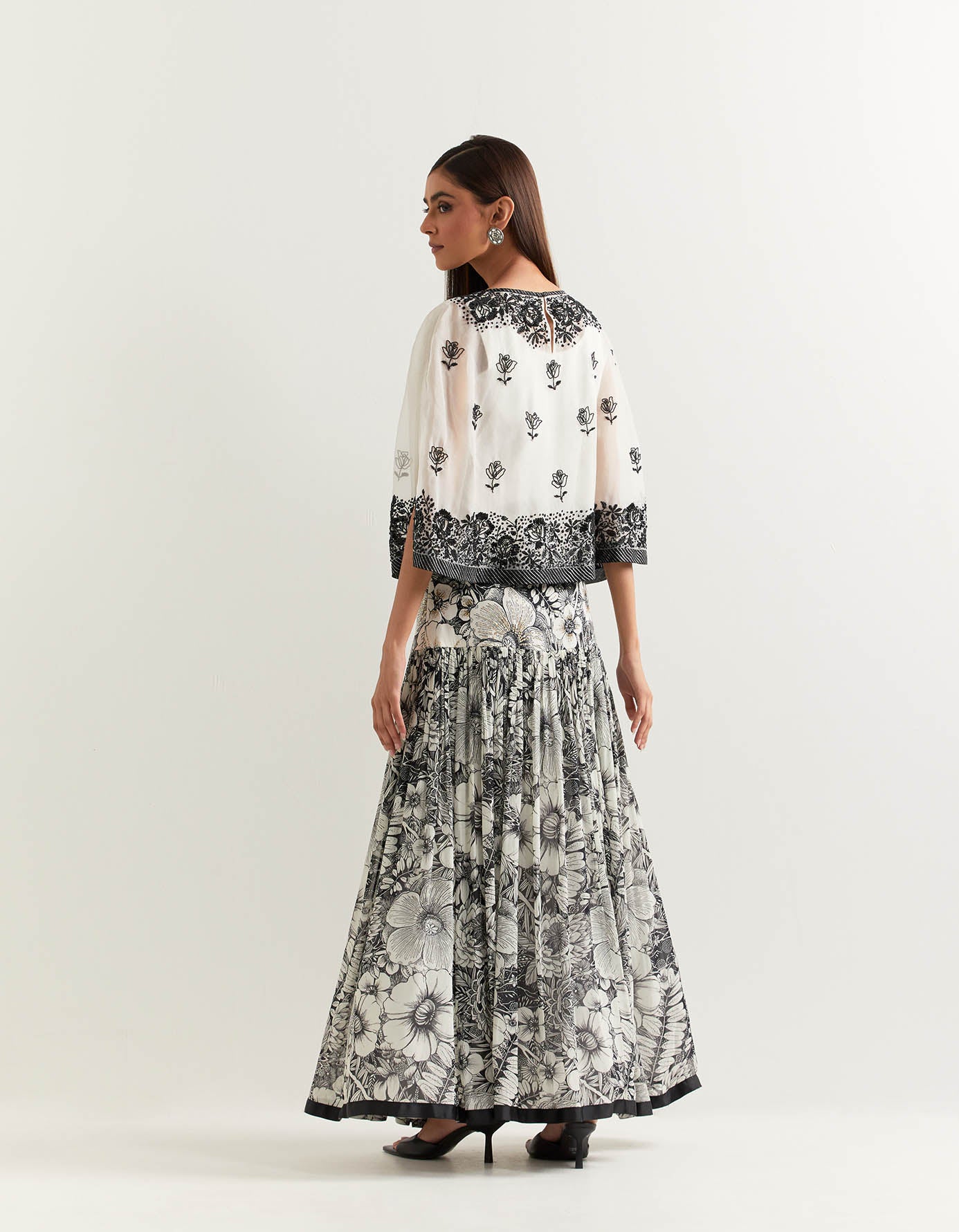 Organza cape embellished with hand sequins embroidery paired with printed gathered georgette skirt