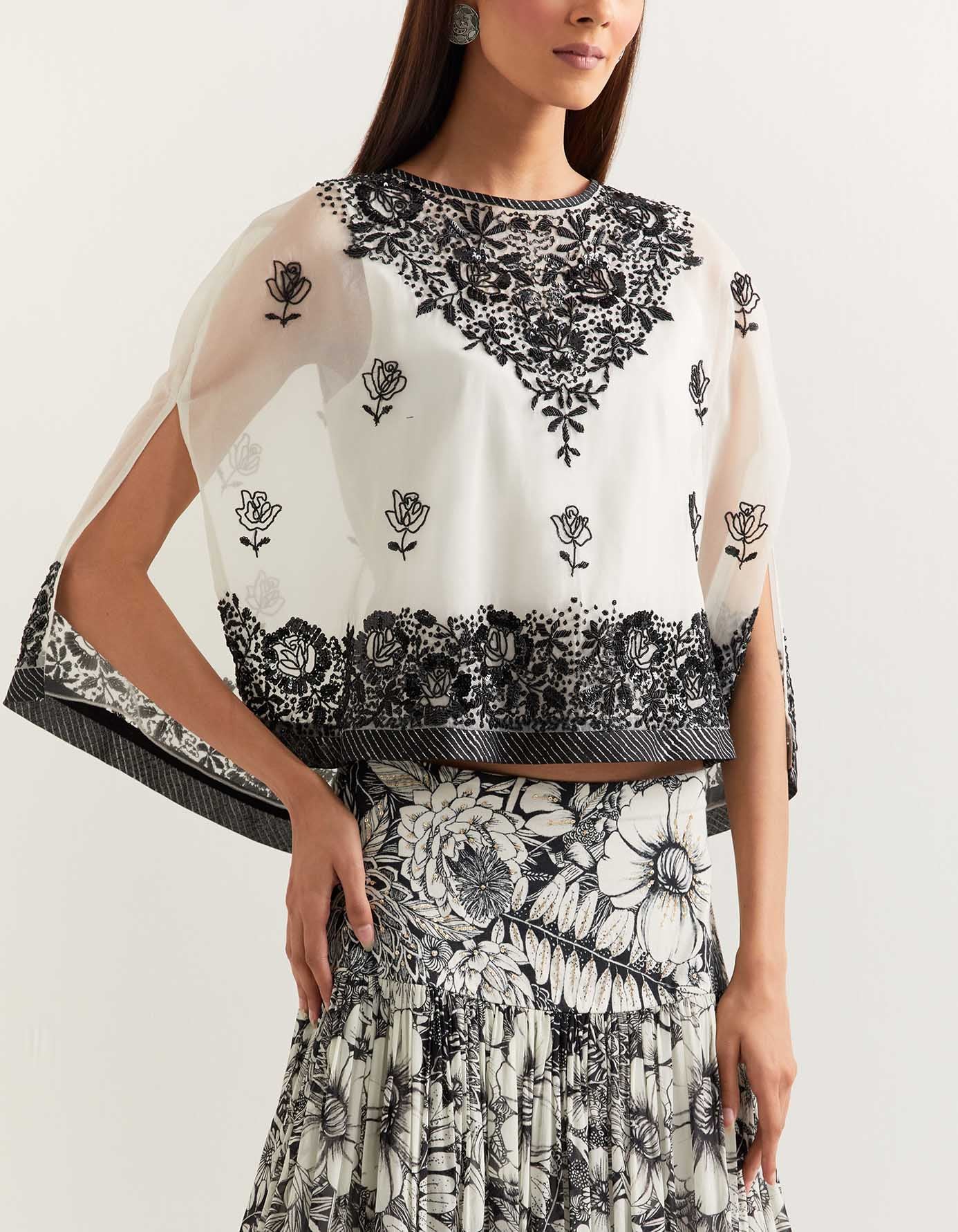 Organza cape embellished with hand sequins embroidery paired with printed gathered georgette skirt