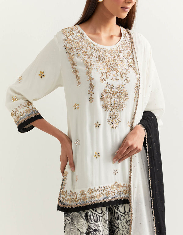 Black and ivory sharara set in exquisite hand embroidery and muqaish work dupatta