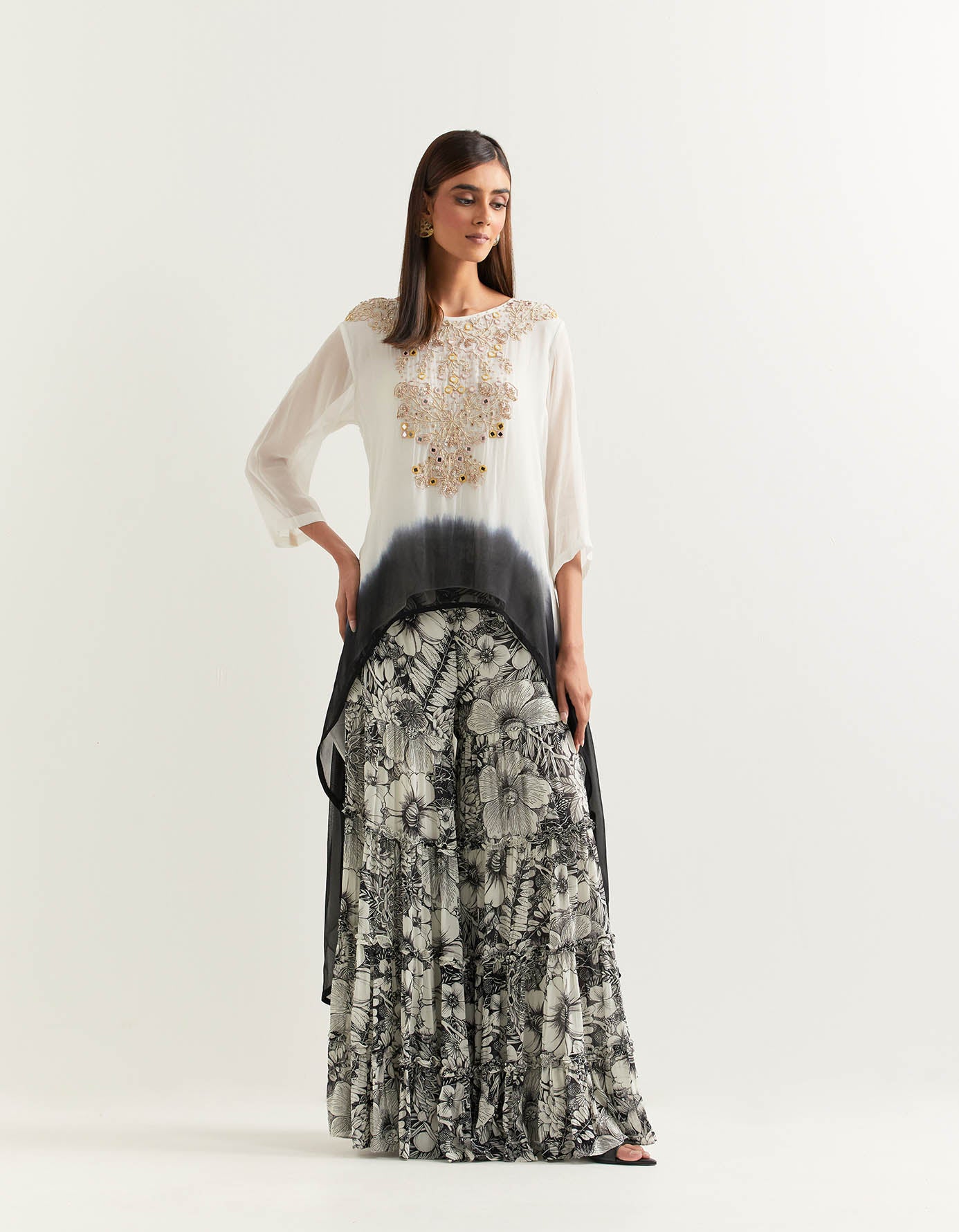 Ivory and black hand embellished high low tunic paired with printed gharara