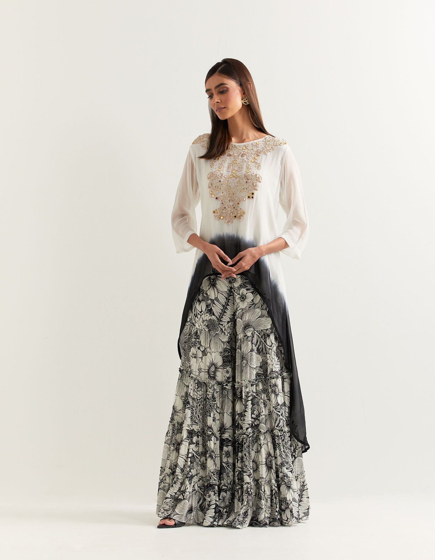 Ivory and black hand embellished high low tunic paired with printed gharara