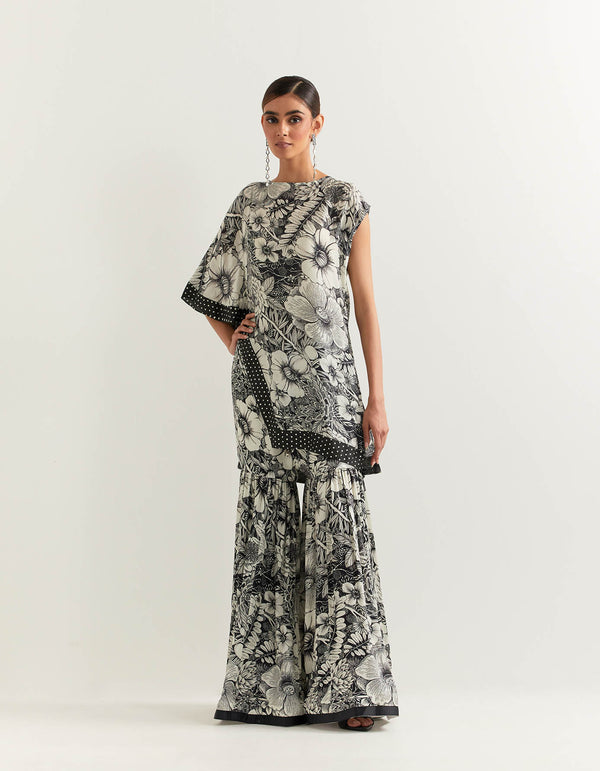 Asymetric printed cape paired with tiered gharara pants