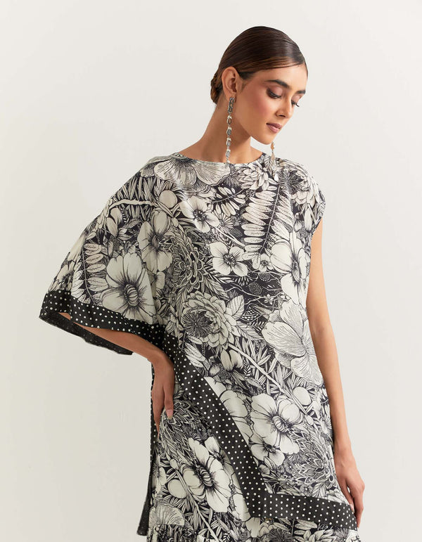 Asymetric printed cape paired with tiered gharara pants