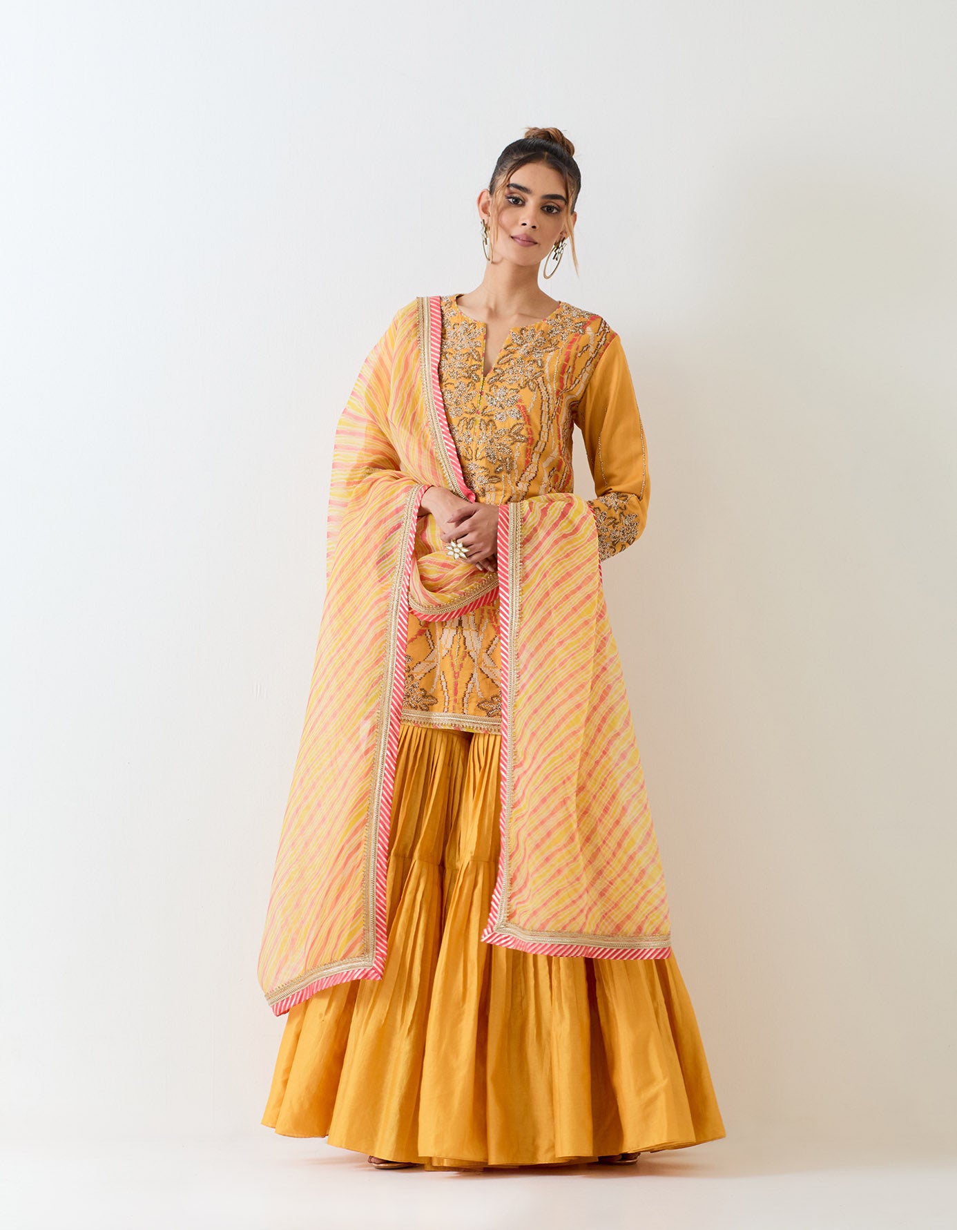 Mustard yellow sharara set in exquisite hand embroidery and tie dye dupatta