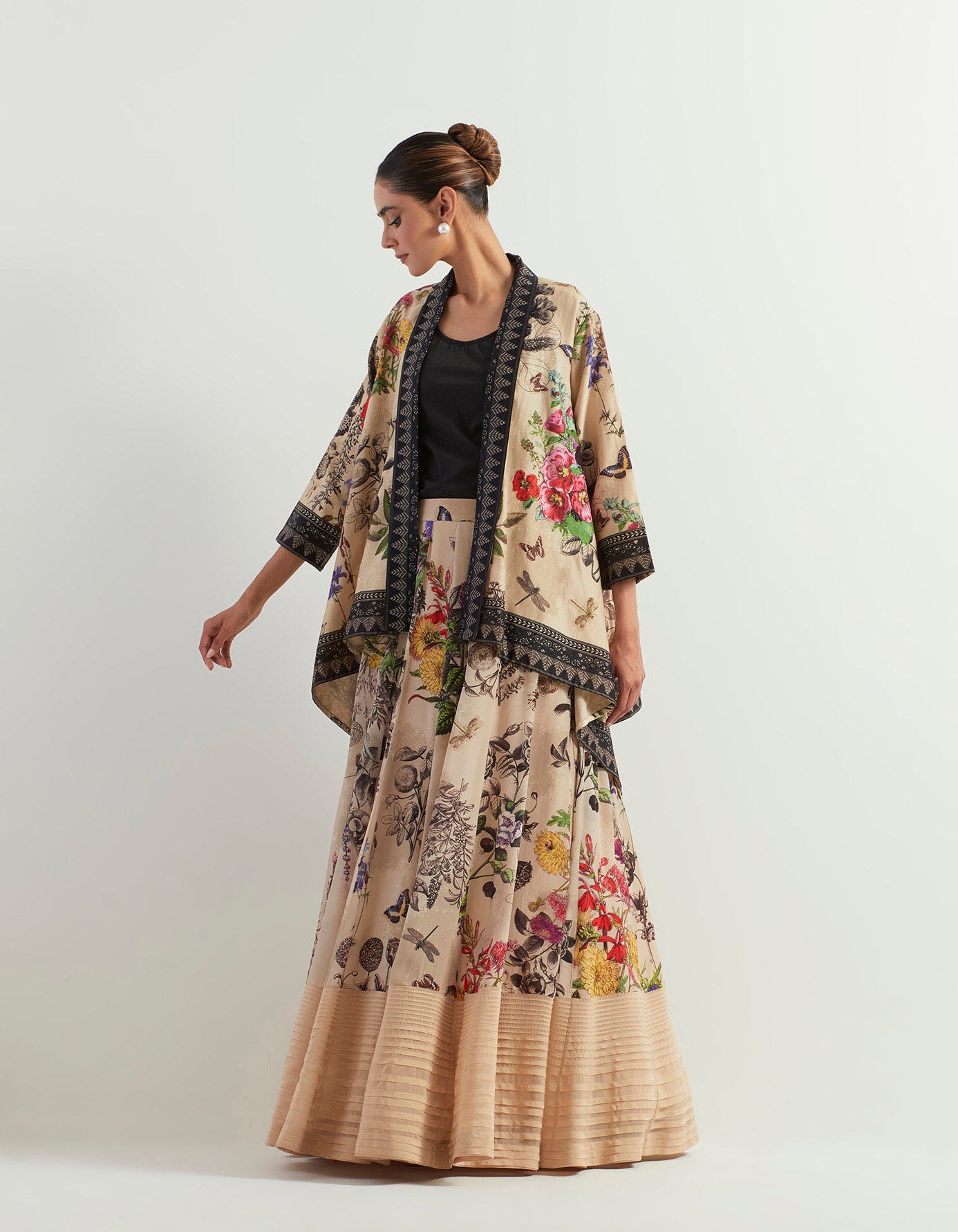 Organza botanical printed skirt paired with stretch inner and chanderi silk cape