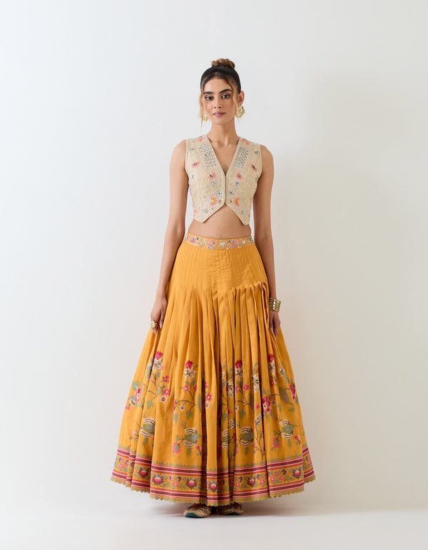 Chanderi silk hand embellished waist coat paired with circular cross stitch embroidery skirt