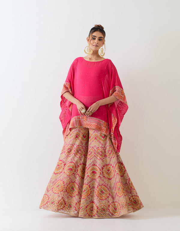 Fuchsia pink muqaish georgette  poncho cape paired with cross stitch embroidered sharara