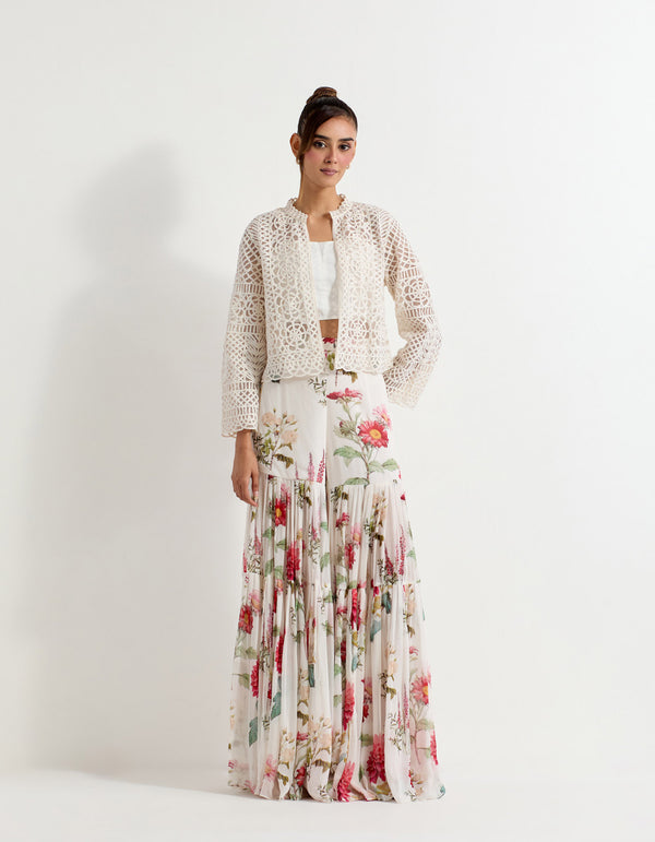 Mesh lattice work embroidered jacket paired with stretch bustier and and daisy printed tiered sharara