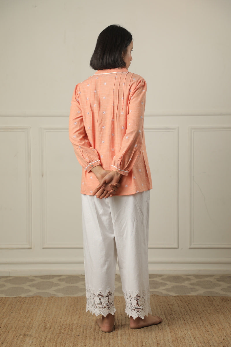 A Top Adorned With Delicate Embroidery