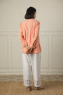 A Top Adorned With Delicate Embroidery