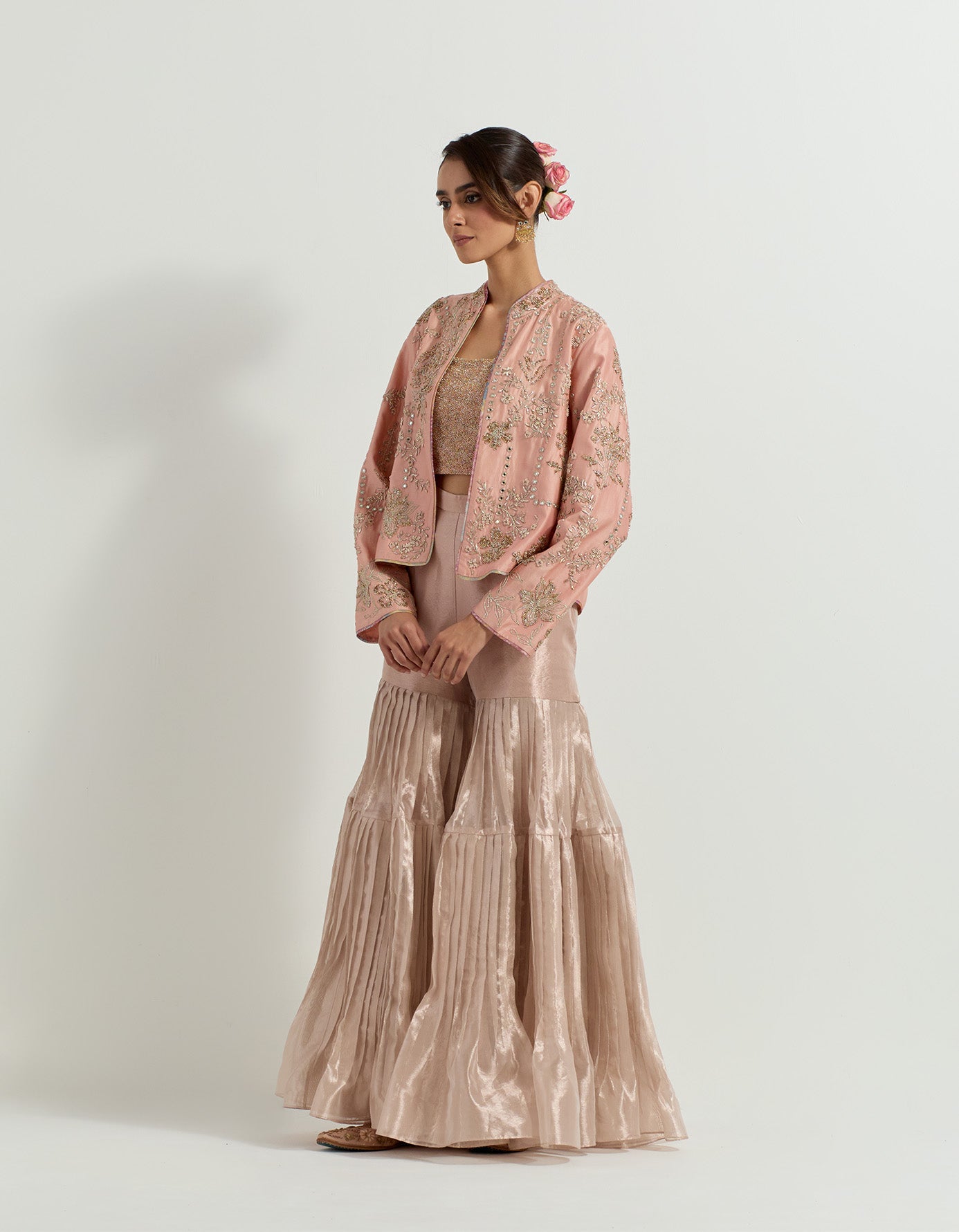 Chanderi silk hand embellished jacket paired with hand embroidered bustier and tissue pleated gharara