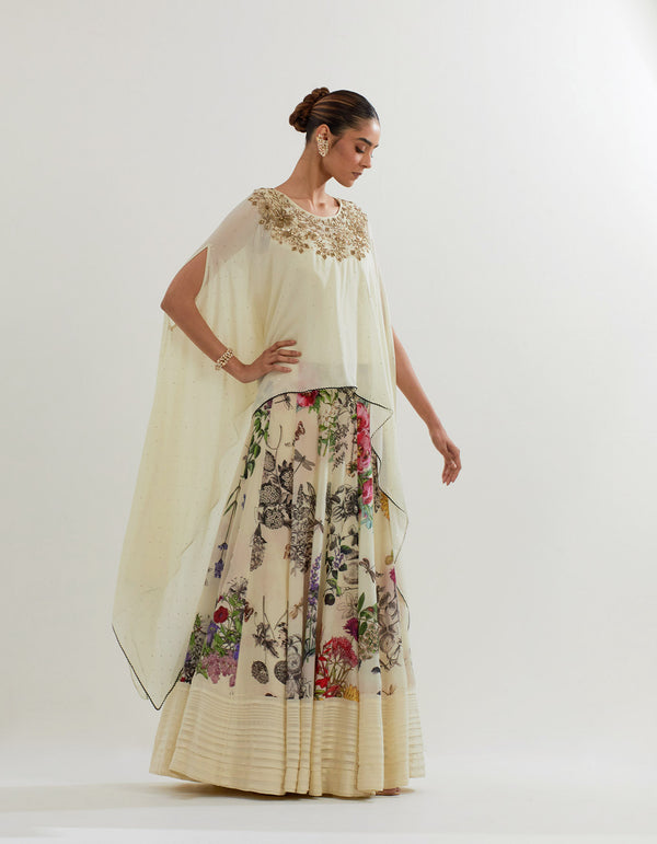 Muqaish georgette dupatta cape paired with botanical printed sharara pants