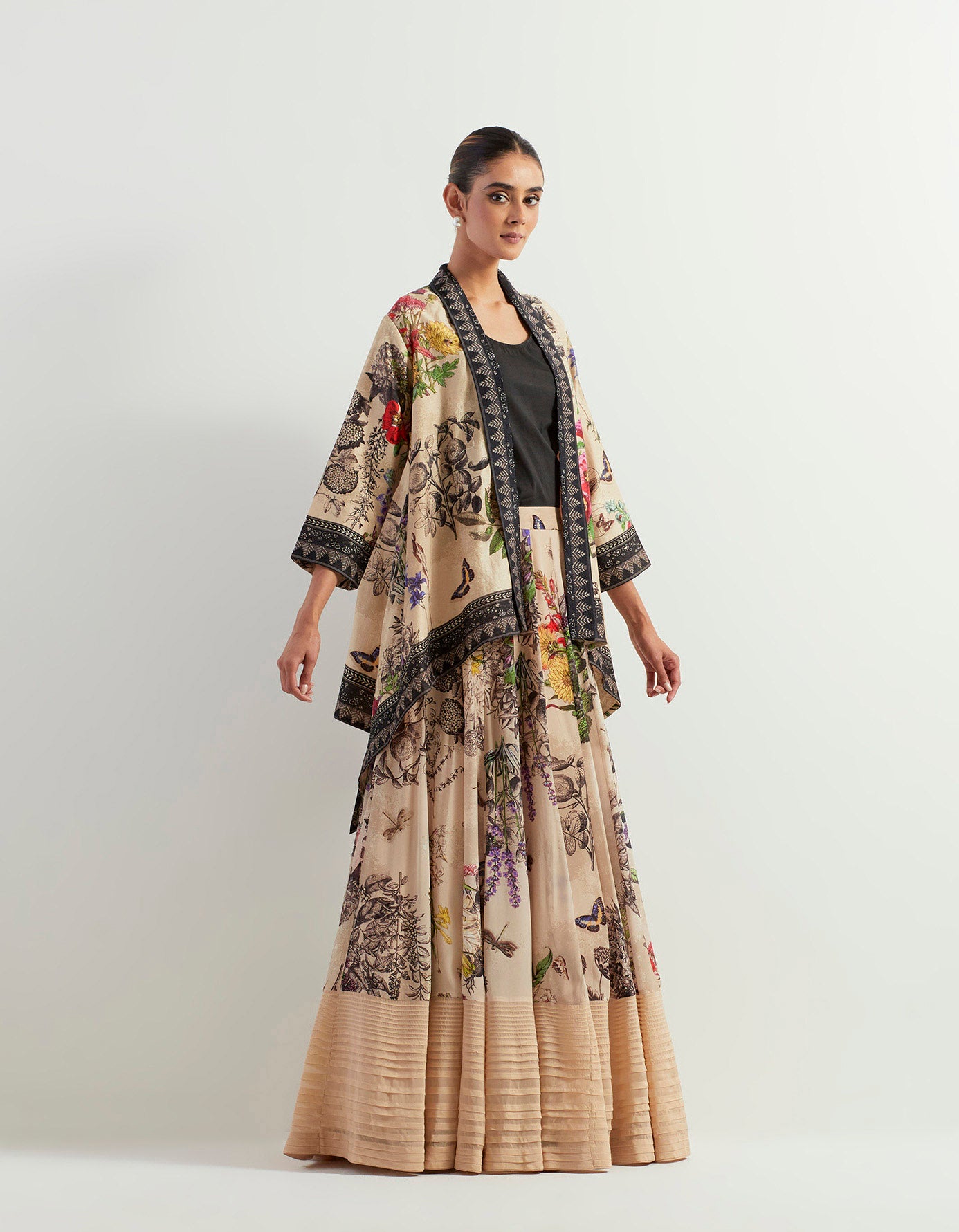 Organza botanical printed skirt paired with stretch inner and chanderi silk cape