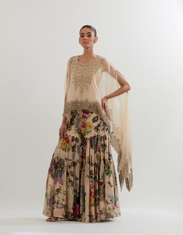 Organza dupatta cape with hand embellished neckline paired with botanical printed pleated sharara