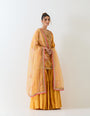 Mustard yellow sharara set in exquisite hand embroidery and tie dye dupatta